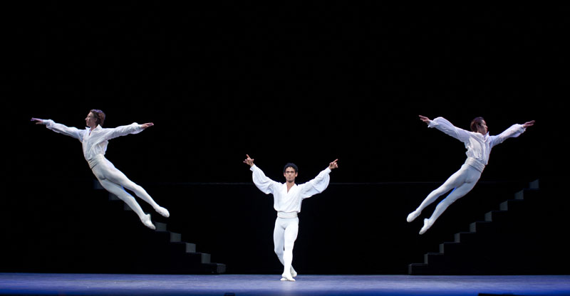 Three male dancers on stage the The Coliseum during Suite en blanc