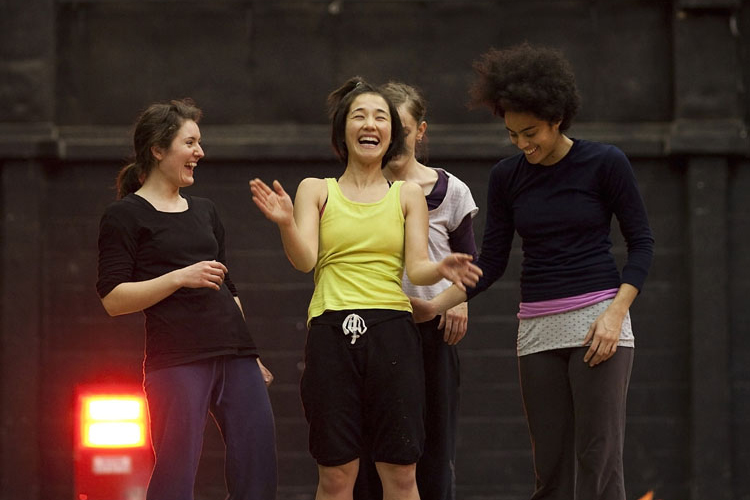 Dancers laughing during a rehearsal of Aida