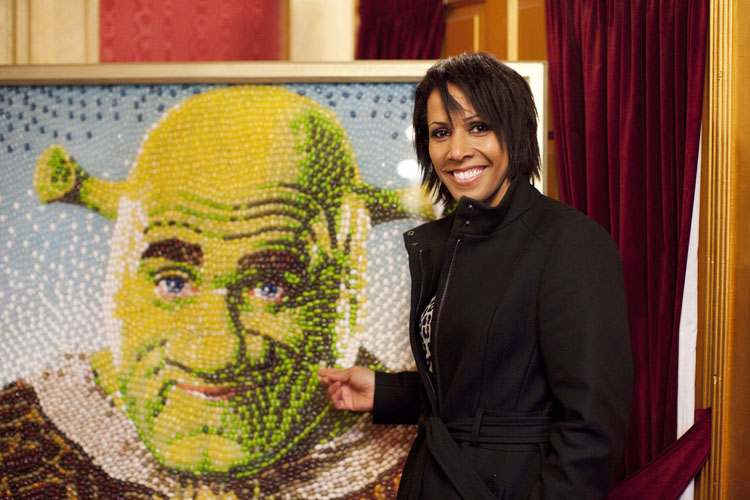 Dame Kelly Holmes with a jelly bean picture of Shrek