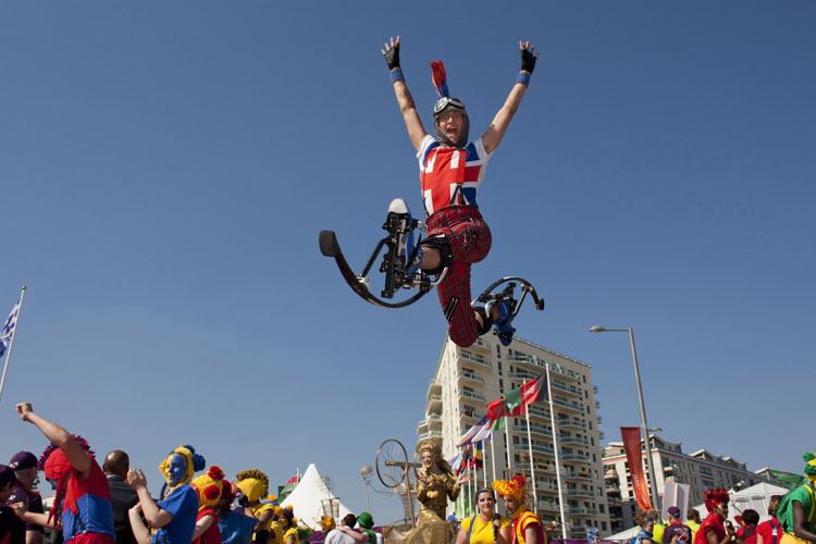 A young actor leaps into the air at a London 2012 Team Welcome Ceremony