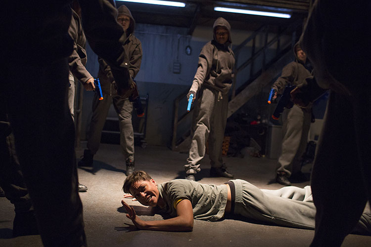 Cush Jumbo's Mark Anthony is surround by attackers in Phylida Lloyd's Julius Caesar