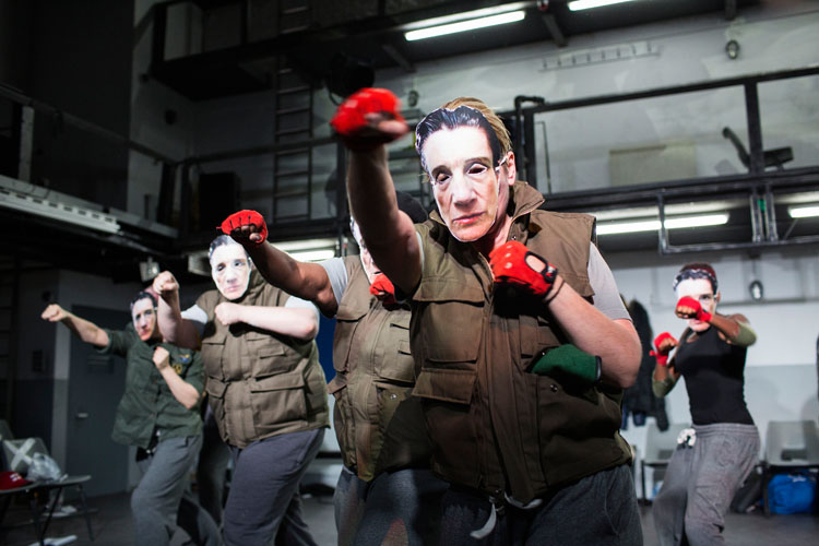 The characters in masks during Henry IV at the Donmar Warehouse