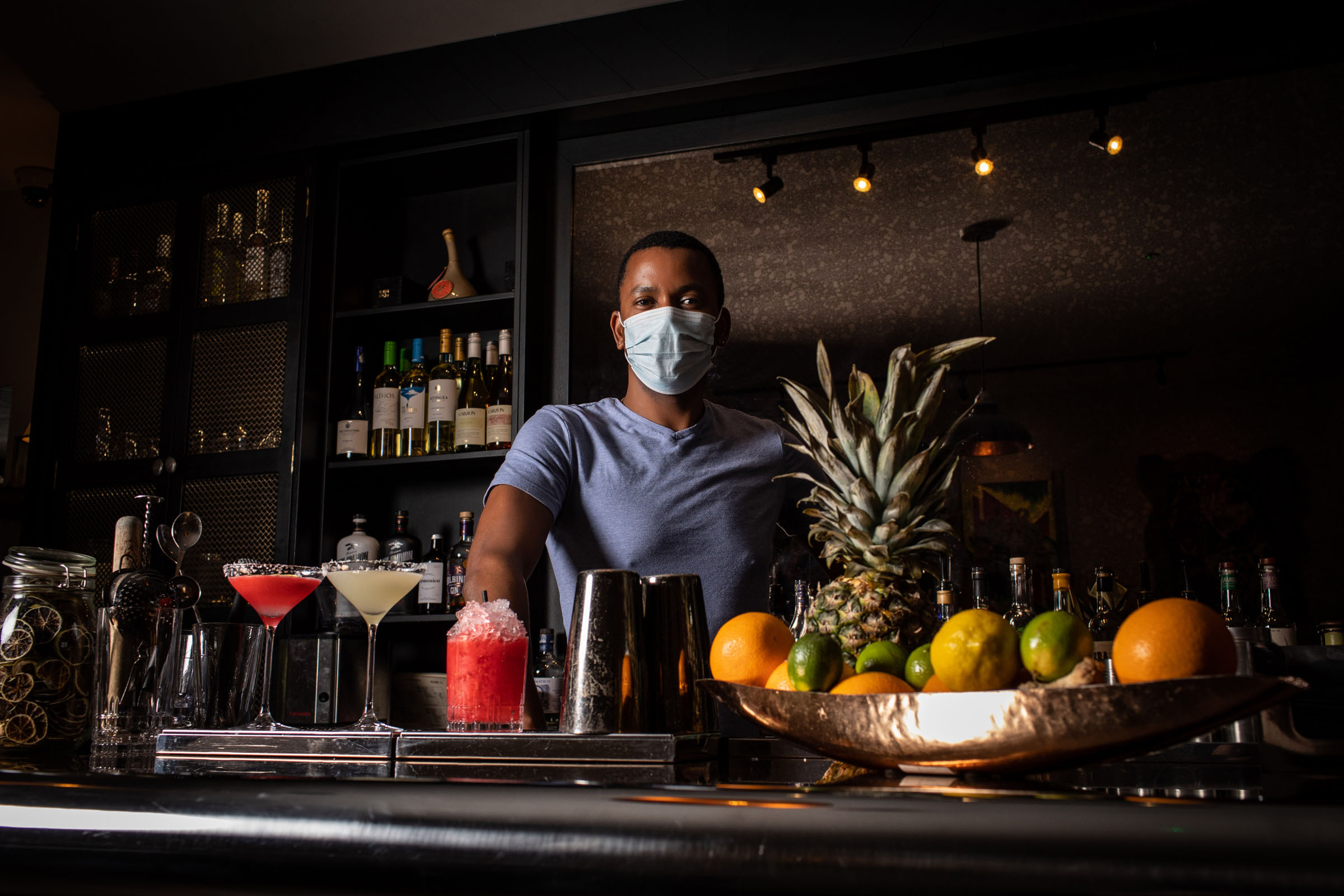 Yalain mixing cocktails in his mask at Paladar in London